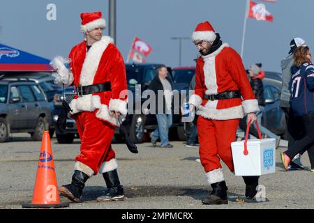 FOXBOROUGH, MA - DECEMBER 24: A New England Patriots fan wearing a foam  Patriots hat and dressed as Santa Claus attends a game between the New  England Patriots and the Cincinnati Bengals