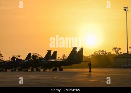 Multiple Airmen conduct a foreign object debris (FOD) walk prior to the ...