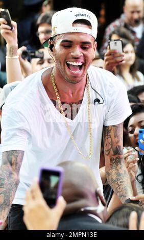 Chris Brown performs live on NBC's 'Today Show' at Rockefeller Plaza in NYC. The 23 year old performer may have a troubled past but he danced through his drama performing several of his hit songs including 'Yeah 3x' and 'Turn Up The Music.' Fans who were camped out since 10 am Thursday started chanting 'we want Chris' in unison in anticipation of his arrival. When he took the stage he addressed the crowd, 'I know y'all came early, so let's party! Okay?' After giving a performance that had the crowd singing and dancing, Chris exited the stage while blowing kisses to his fans. New York, NY. 8th Stock Photo