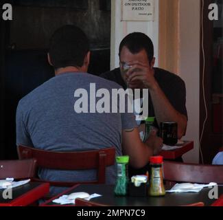 Exclusive!! Just days after beating the rap on alleged assault charges pending from an August brawl, MadonnaÕs ex Chris Paciello - real name Christian Ludwigsen - once again enjoys life as a free man seen having lunch with friends on famed Sunset Boulevard.  Paciello, who has previous links with a mob murder, wasnÕt too pleased to see our photographer and hid his face behind his drink.  Paciello and Villa nightclub owner Reza Roohi spent time in jail in August after allegedly an attack in which they are said to have hit the victim with a car and then attacked him.  The attack was caught on tap Stock Photo