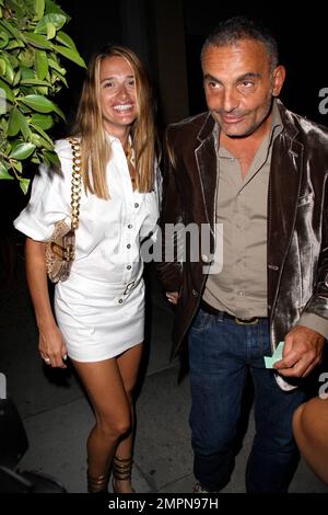 Fashion Designer Christian Audigier and his wife Ira attend a red