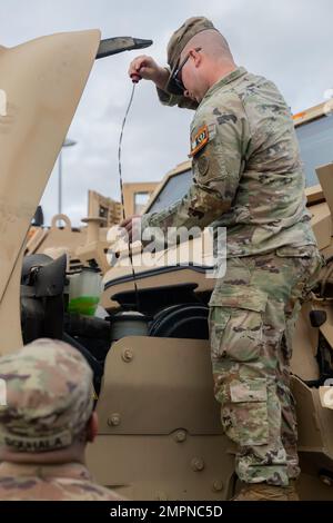 An M1224 mine-resistant ambush protected vehicle departs to transport a ...