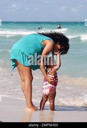 American recording artist, actress, dancer and model, Christina Milian, spends time with her daughter Violet on South Beach after the Rally for Kids with Cancer Scavenger Cup weekend hosted by Eden Roc Renaissance Miami Beach in Miami Beach, Fl.  04/29/2011 Stock Photo
