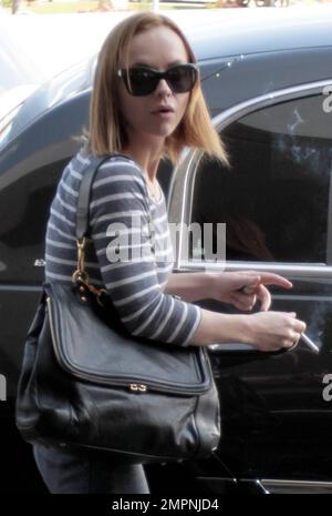 Actress Christina Ricci smoking a cigarette at LAX Airport before ...