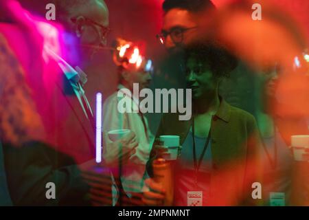 Business colleagues having drinks during seminar in exhibition center Stock Photo