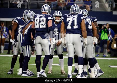 Dallas Cowboys quarterback Dak Prescott (4) in the huddle while on