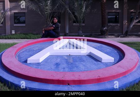 Karen Butler, management and program analyst, Civilian Personnel Officer, Area Support Group – Kuwait, poses in front of ASG-KU Building, Camp Arifjan, Kuwait, Sept. 11, 2022. Stock Photo