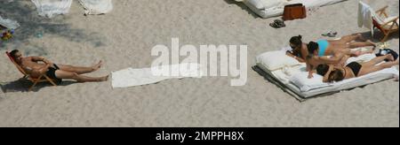 Exclusive!! Colin Farrell, son James and Sister Catherine(?)relax beachside at a Miami Hotel, 5/28/05 All   '' Stock Photo