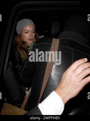 Colin Farrell protectively cradles his son Henry Tadeusz wrapped in a blanket as he and his girlfriend Alicja Bachleda arrive at LAX from London. Los Angeles, CA. 01/13/10.     . Stock Photo