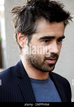Irish bad boy, actor Colin Farrell arrives via the back door at the 'Jimmy Kimmel Live!' studio to appear on the ABC talk show.  Farrell, 34, was at the show to promote his latest film 'Ondine', a drama that was filmed in Farrell's home country and is being released in the U.S. on June 4th.  The Golden Globe and IFTA award winner happily signed autographs, posed for photos with fans and despite looking a bit scruffy with his messy hair and beard, looked sharp in a pinstriped jacket.  Farrell, who is dating his 'Ondine' co-star, actress Alicja Bachleda, wore a ring on his wedding ring finger. L Stock Photo