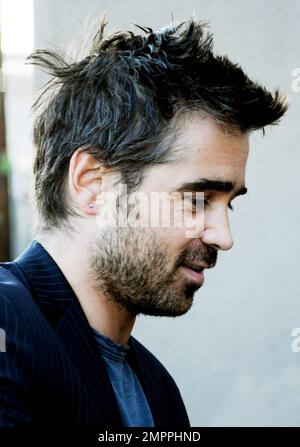 Irish bad boy, actor Colin Farrell arrives via the back door at the 'Jimmy Kimmel Live!' studio to appear on the ABC talk show.  Farrell, 34, was at the show to promote his latest film 'Ondine', a drama that was filmed in Farrell's home country and is being released in the U.S. on June 4th.  The Golden Globe and IFTA award winner happily signed autographs, posed for photos with fans and despite looking a bit scruffy with his messy hair and beard, looked sharp in a pinstriped jacket.  Farrell, who is dating his 'Ondine' co-star, actress Alicja Bachleda, wore a ring on his wedding ring finger. L Stock Photo