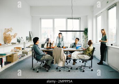Multiracial business professionals discussing in meeting at office Stock Photo