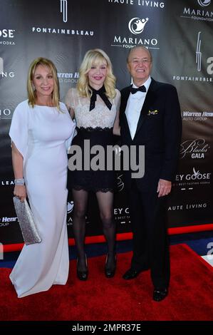 Lea Black, Courtney Love and Roy Black attend The Blacks Annual Gala held at Fontainebleau Miami Beach in Miami Beach, FL. October 25, 2014. Stock Photo