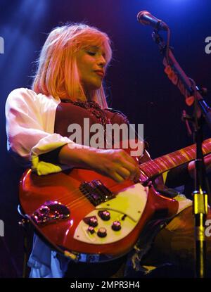 Courtney Love smokes a cigarette on stage as she performs live in ...
