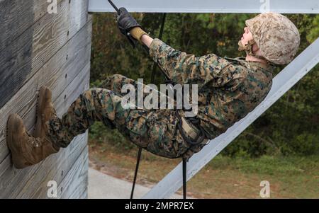 Recruits with India Company, 3rd Recruit Training Batallion, conduct the rappel tower, November 14, 2022. The rappel tower test recruits fears of heights and builds confidence in their gear. (US Marine Corps Photos by Lance Cpl. Keegan Jones). Stock Photo