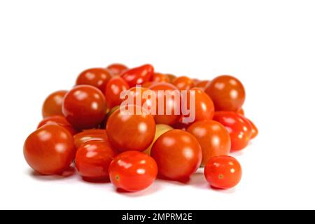 Various mini tomatoes against a white background Stock Photo