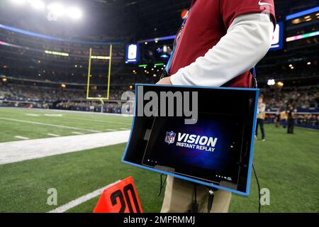 A Microsoft Surface is used for instant replays, on the sideline of an NFL  football game