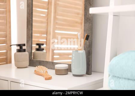 Different toiletries near mirror in modern bathroom Stock Photo