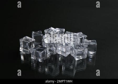 Crystal clear ice cubes on black background Stock Photo