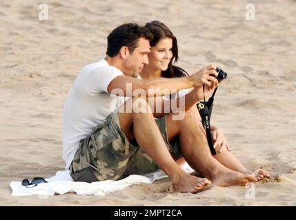 'Hawaii Five-0' star and American comedian Dane Cook spends a romantic evening on the beach at sunset with his reported girlfriend, a beautiful brunette. The two set up a blanket and cuddled by the surf. They also snapped photos of each other, even setting up a table and setting the timer on the camera to take some shots together. Honolulu, HI. 2nd September 2011. Stock Photo