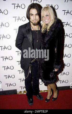 Musician Dave Navarro and girlfriend Lindsey Hartley walk the red carpet at the nightclub Tao in Las Vegas, NV. 1/9/09. Stock Photo