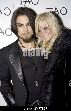 Musician Dave Navarro and girlfriend Lindsey Hartley walk the red carpet at the nightclub Tao in Las Vegas, NV. 1/9/09. Stock Photo