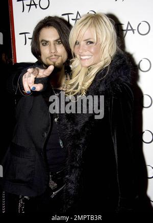 Musician Dave Navarro and girlfriend Lindsey Hartley walk the red carpet at the nightclub Tao in Las Vegas, NV. 1/9/09. Stock Photo