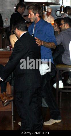 After recovering from an Achilles Tendon injury suffered last March, David Beckham grabs a bite at the restaurant Cleo at The Redbury. David strolled through the restaurant with his hand on a friend's shoulder and semmed very interested in what other diners were having for dinner. Hollywood, CA. 9/14/10. Stock Photo