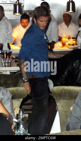 After recovering from an Achilles Tendon injury suffered last March, David Beckham grabs a bite at the restaurant Cleo at The Redbury. David strolled through the restaurant with his hand on a friend's shoulder and semmed very interested in what other diners were having for dinner. Hollywood, CA. 9/14/10. Stock Photo