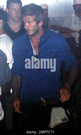 After recovering from an Achilles Tendon injury suffered last March, David Beckham grabs a bite at the restaurant Cleo at The Redbury. David strolled through the restaurant with his hand on a friend's shoulder and semmed very interested in what other diners were having for dinner. Hollywood, CA. 9/14/10. Stock Photo