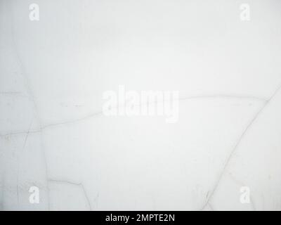 The white concrete wall with the long cracked of the modern house in the urban area, front view for the background. Stock Photo