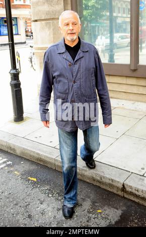 '70s and '80s hearthrob singer and actor David Essex waves and smiles for the cameras as he leaves the BBC. London, UK. 7/31/10.     . Stock Photo