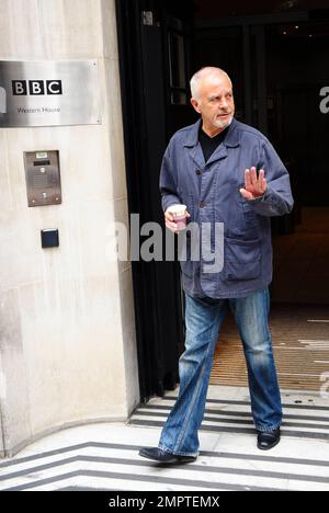 '70s and '80s hearthrob singer and actor David Essex waves and smiles for the cameras as he leaves the BBC. London, UK. 7/31/10.     . Stock Photo