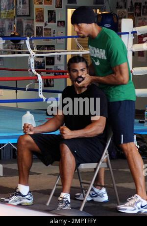 EXCLUSIVE!! After stopping to fill up his Aston Martin sports car with petrol and picking up some groceries earlier in the day, UK Heavyweight Boxing Champion David Haye spends time at a local gym to begin training for his unification clash with Wladimir Klitschko, due to take place on July 2nd in Germany. Haye got in a workout with a friend and a trainer while at the gym, sparring and working on stretching and resistance exercises. Miami Beach, FL. 3/17/11. Stock Photo