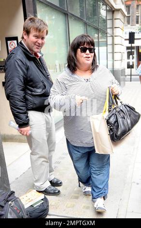 British actress and comedienne Dawn French is all smiles as she arrives for an appointment at BBC Radio 2. French has reportedly had some turbulence in her life recently: She's been supporting her best friend Jennifer Saunders, who is suffering from cancer and she recently ended her 25-year marriage to Lenny Henry. London, UK. 7/16/10. Stock Photo