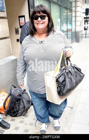 British actress and comedienne Dawn French is all smiles as she arrives for an appointment at BBC Radio 2. French has reportedly had some turbulence in her life recently: She's been supporting her best friend Jennifer Saunders, who is suffering from cancer and she recently ended her 25-year marriage to Lenny Henry. London, UK. 7/16/10.   . Stock Photo