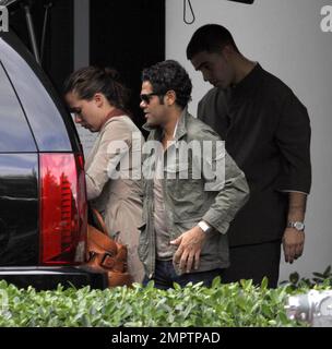 Exclusive!! Jamel Debbouze and wife Melissa Theuriau leave their hotel after a weeklong vacation in South Beach. Miami, FL, 3/1/09 Stock Photo