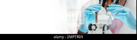Banner with laboratory worker looking at sample through microscope Stock Photo
