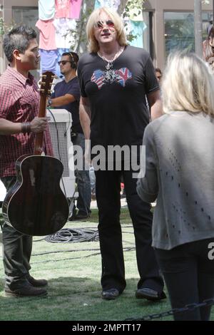 Def Leppard performs an acoustic set during a television appearance at The Grove shopping center. Los Angeles, CA. 1st June 2012. Stock Photo