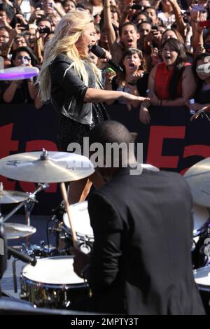 Wearing a black sequenced mini dress with a leather jacket and black ankle boots, singer Demi Lovato performs live the 2012 MTV Video Music Awards held at the Staples Center in Los Angeles, CA. 6th September 2012. Stock Photo