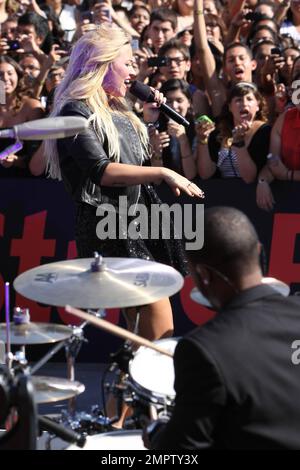 Wearing a black sequenced mini dress with a leather jacket and black ankle boots, singer Demi Lovato performs live the 2012 MTV Video Music Awards held at the Staples Center in Los Angeles, CA. 6th September 2012. Stock Photo