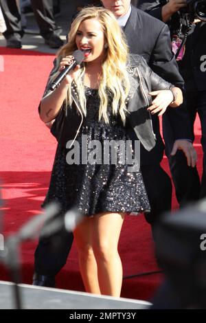 Wearing a black sequenced mini dress with a leather jacket and black ankle boots, singer Demi Lovato performs live the 2012 MTV Video Music Awards held at the Staples Center in Los Angeles, CA. 6th September 2012. Stock Photo