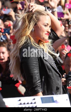 Wearing a black sequenced mini dress with a leather jacket and black ankle boots, singer Demi Lovato performs live the 2012 MTV Video Music Awards held at the Staples Center in Los Angeles, CA. 6th September 2012. Stock Photo