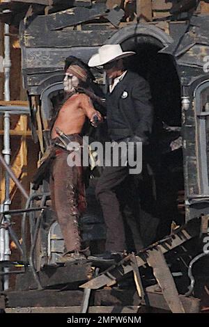 Johnny Depp and Armie Hammer, dressed in their characters Tonto and the