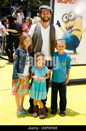 Noah Wyle and family pose on the yellow carpet at the premiere of 'Despicable Me' held at Nokia Theatre L.A. Live.  Universal Pictures' new 3-D CGI film, which features the voices of Russell Brand, Steve Carell and Julie Andrews, took place during the 2010 Los Angeles Film Festival. Los Angeles, CA. 06/27/10. Stock Photo