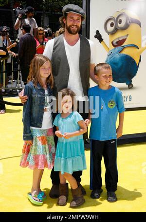 Noah Wyle and family pose on the yellow carpet at the premiere of 'Despicable Me' held at Nokia Theatre L.A. Live.  Universal Pictures' new 3-D CGI film, which features the voices of Russell Brand, Steve Carell and Julie Andrews, took place during the 2010 Los Angeles Film Festival. Los Angeles, CA. 06/27/10. Stock Photo