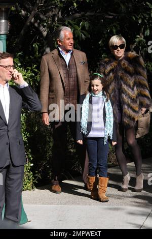 George Hamilton and girlfriend Barbara Sturm attend Diane von Furstenberg's star studded annual afternoon pre-Oscar house party in Beverly Hills ahead of the 83rd Annual Academy Awards. Los Angeles, CA. 02/26/11. Stock Photo