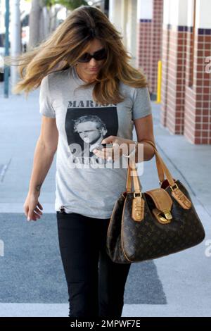 Latin American actress and model Daisy Fuentes wears a Marlon Brando t  shirt as she shows off her luxurious locks while leaving a Beverly Hills  hair salon after an appointment. Los Angeles, CA. 5/26/10 Stock Photo -  Alamy