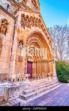 The entrance portal ot Jak Chapel with carved stone sculptures and geometric ornament, Vajdahunyad Castle in Budapest, Hungary Stock Photo