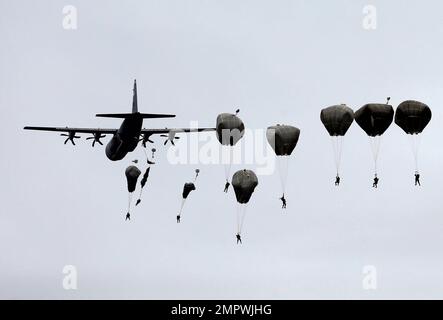 Members of the U.S. Army 173rd Airborne Brigade and Serbian Army parachutists jump from a US Air Force C-130 transport aircraft during a bilateral Serbian and U.S. airborne exercise at Lisicji jarak airport, some 15 kilometers (10 miles) north of Belgrade, Serbia, Friday, Nov. 17, 2017. American and Serbian paratroopers have held joint exercises in Serbia which is watched with unease in Russia that is trying to increase its influence in the Balkans. (AP Photo/Darko Vojinovic)